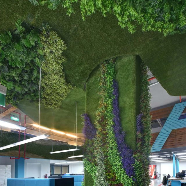 Artificial Grass and plants Clad a Pillar and Ceiling in Office